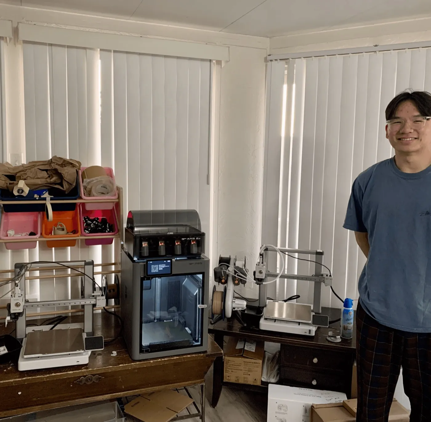 Four 3D printers on a desk